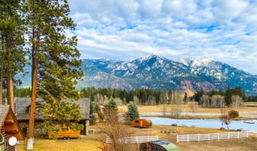 View of trailer cabins and campground with mountains in the background
