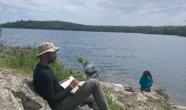 Person journaling in the wilderness